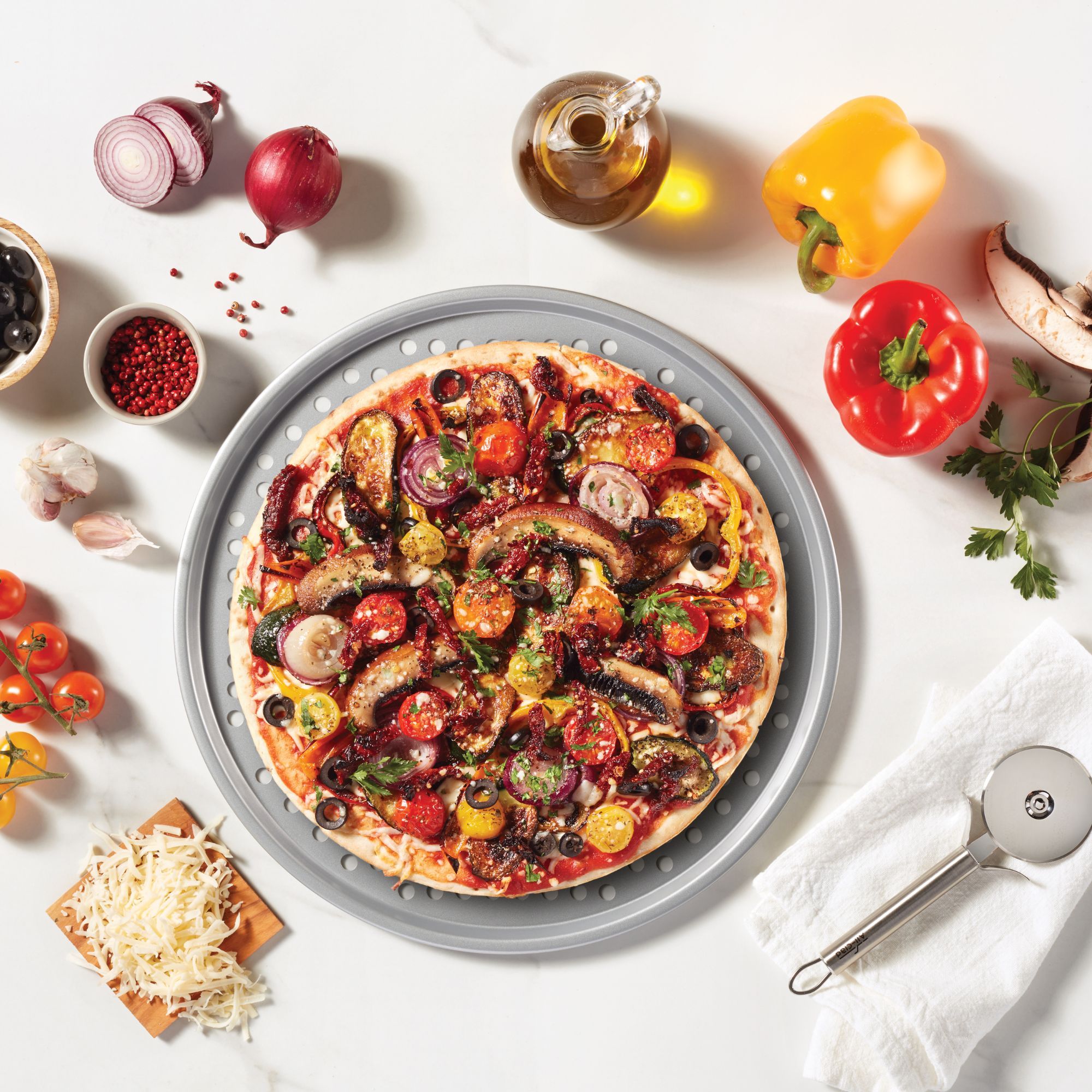 The ROCK WAVE plaque à pizza perforée antiadhésive de 37 cm (14.5") - The Rock - Plaque à pizza - - La Guilde Culinaire